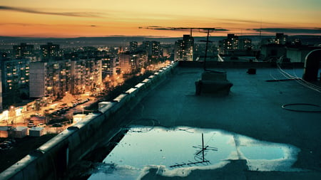 Coming to Life - cars, sunny, yellow, people, blue, reflection, rooftop, roof, streets, skyscrapers, sky, sun, puddle, clouds, city, orange, buildings, life, grey, sunset, lights, day