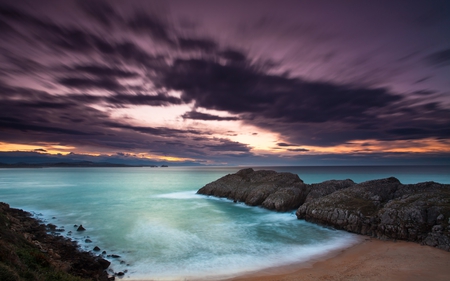 Purple Sunset - beach, splendor, sand, purple sunset, purple, view, sky, clouds, beautiful, sea, beauty, colors, lovely, ocean, colorful, nature, sunset, waves, peaceful, rocks