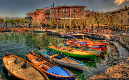 Beautiful View - terrace, colorful, chairs, port, view, reflection, umbrella, sunny, boat, lake, building, boats, landscape, buildings, nature, chair, beautiful, beauty, sky, trees, harbour, italy, peaceful, water, pretty, clouds, architecture, tree, house, houses, lovely, italia, town, alley, splendor, colors