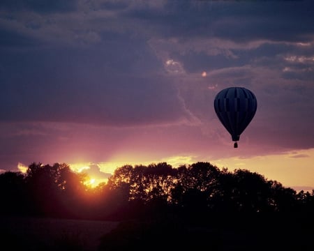 Hot Air Balloon at Sunset - balloon, trees, sun, clouds