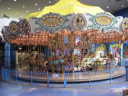 Carousel at West Edmonton Mall , Alberta  - white, yellow, blue, photography, carousel, amusement parks