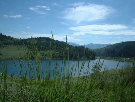 Elk Lake - clouds, water, green, lake, grass, hillside, mountains