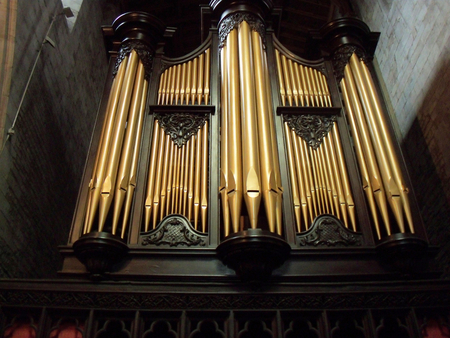 Organ in St Laurence Charch - tower, organ, dark wall, gold pipes