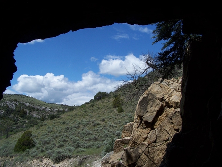 From Inside the Cave - trees, hills, clouds, blue sky, cave, rocks