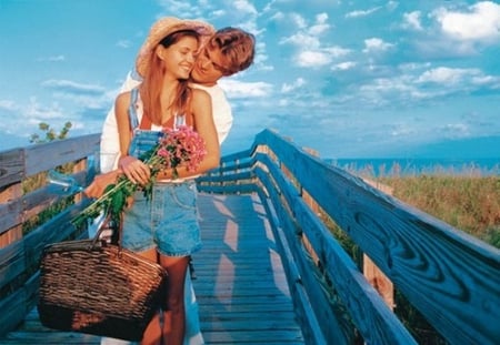 Because of you... - hug, beauty, sky, feeling, sun, clouds, grass, bridge, love, glass, couple, beautiful love, picnic, tenderness, bag, romantic, blue, smile, flowers