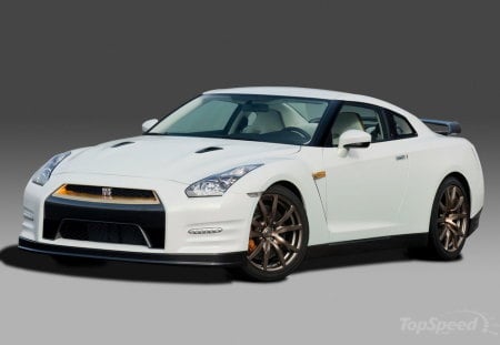 nissan gtr - two seater, gold alloys, white, front engine