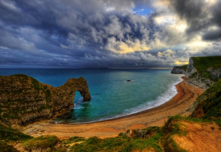 Lovely View - beach, splendor, landscape, grass, sand, view, sky, storm, clouds, sunlight, beautiful, sea, stormy, beauty, colors, lovely, ocean, nature, sunset, green, waves, peaceful