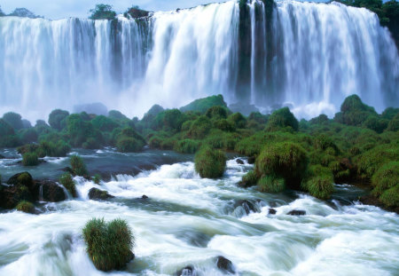 IGUAZU WATERFALL - sky, photography, water, waterfall, argentina, white, green, rock, brush, falls, daylight, day, waterfalls, wallpaper, bushes, nature, flowing, blue, beautiful, iguazu, new