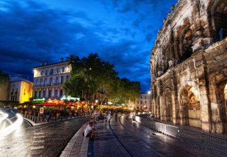 Nimes,France - monument, terrace, night, umbrella, streets, way, road, city, beauty, colors, architecture, nature, lights, nimes, green, building, umbrellas, alley, people, blue, splendor, bar, leaves, view, france, sky, clouds, trees, beautiful, buildings, lovely, tree, street, colorful, peaceful