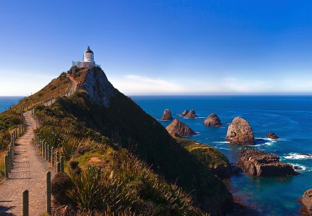 Nugget Point - sky, ocean, mountain, nugget, path, zealand, rocks, trail, blue, point, new