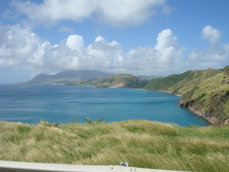 A view on the Oceans - clouds, oceans, blue, photography, grass, islands, white, nature, green, mountains, sky