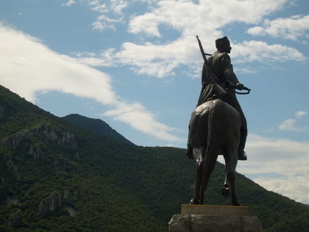 Herald - clouds, soldier, trees, monument, photography, forest, photo, horse, mountain, nature, green, sky, bulgaria, statue, rocks