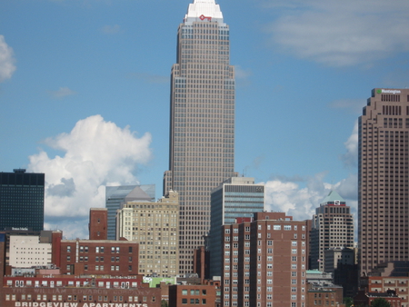 From A Distance - clouds, blue, city, buildings, tall, sky