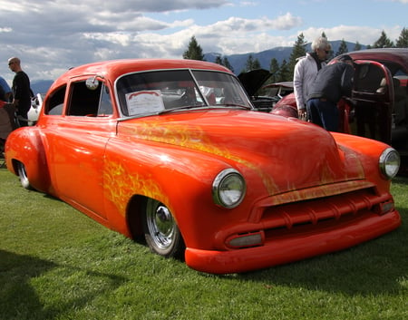 Chevrolet 1950 at the  Radium Hot Springs car show 17 - chevrolet, trees, photography, mountains, white, silver, headlights, clouds, tire, green, orange