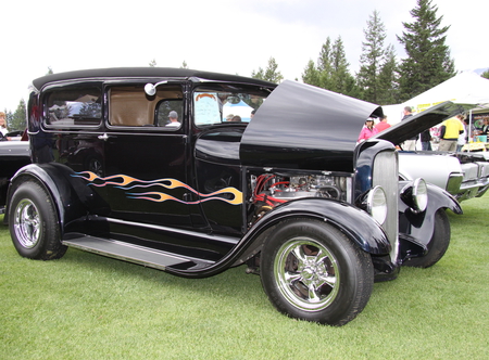 Ford 1929 in Radium Hot Springs car show 23 - headlights, red, silver, black, yellow, tire, ford, nickel, car, engine, photography, trees, green