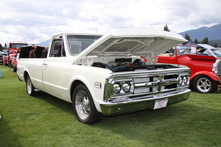 GMC truck in Radium Hot Springs car show 30 - nickel, hose, trees, truck, photography, gmc, mountains, white, silver, red, tire, green