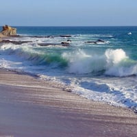 WATCHING THE WAVES ROLL IN