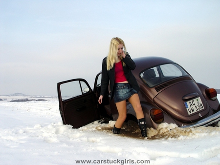 I bet the back wheel fell into a hole - woman, snow, sexy, volkswagen, other