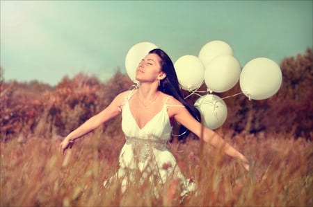 Feels so good - woman, beautiful day, beauty, sky, trees, feeling, magic, sun, hair, beautiful lady, balloons, free, lovely face, clouds, grass, sunny day, fly, lady, girl, white dress, nature, emotions