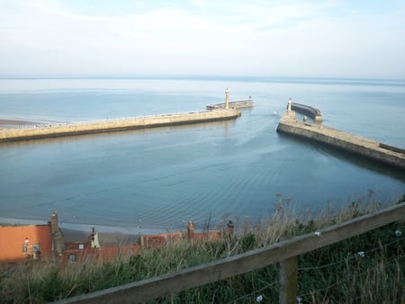 Whitby Bay UK - homes, fence, locks, sea