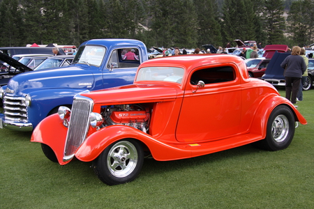 Chevrolet at the Radium Hot Springs car show 83  - grills, chevrolet, trees, chrome, photography, tires, engine, headlights, car, red, blue, green, grass