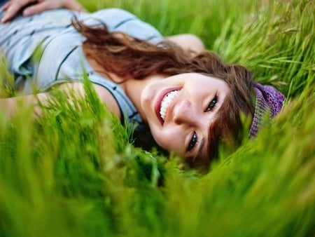 Smile and be happy - beauty, stare, hat, look up, hair, eyes, sweet smile, enjoy, face, free, lovely face, grass, sunny day, girl, lovely, nature, beautiful, smile, happiness, happy