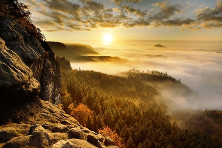 The beauty of a sunrise - beauty, sky, trees, sun, wallpaper, mist, rocks, nature, forest, clouds, colors, sunrise