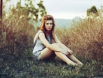 Girl resting on the grass