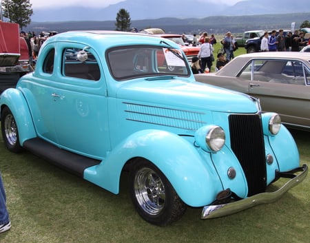 Ford 1936 at the Radium Hot Springs car show 99  - Chrome, trees, headlights, blue, Tires, Photography, nickel, black, Ford, car, silver, red, green, mountains