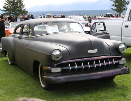 Chevrolet 1954 at the  Radium Hot Springs car show 105  - chevrolet, photography, mountains, black, logo, white, silver, headlights, grey, car, clouds, tire, green, tree