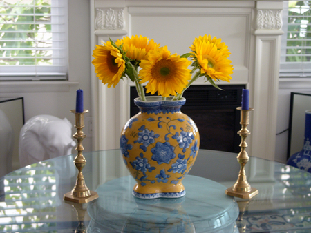 Sunflowers makes me happy â™¥ - candleholders, livingroom, sunflowers, yellow and blue, candles, wonderful, yellow, window, golden, beautiful house, style, morning, white fireplace, fashion, cristal table, vase, entertainment, bright, blue