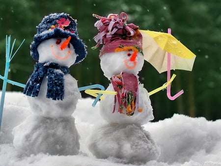 Snowmen with umbrella