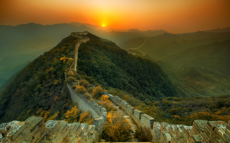 The Great Wall Of China - beauty, sky, wonder, great wall, trees, peaceful, sun, mountains, sunset, amazing, view, clouds, the great wall of china, tree, grass, stone, china, landscape, sunlight, hills, lovely, ancent, nature, woods, forest, wall, beautiful, fog, splendor, sunrise, haze