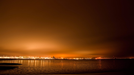 Golden Lights - brown, beach, evening, reflection, water lights, city, golden, dusk