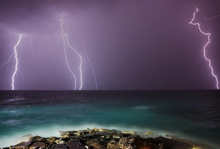 Natures Power - sky, ocean, scary, blue, horizen, lightening, rocks