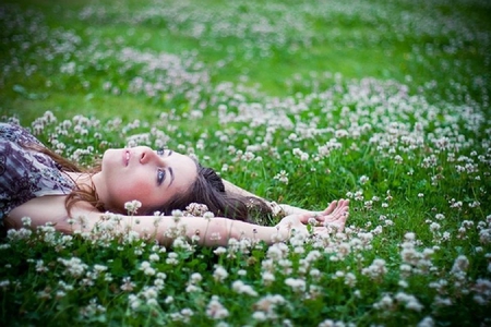 girl laying on the grass - nice, laying, pretty, female, flowers, lovely, grass, cute