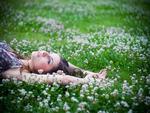 girl laying on the grass