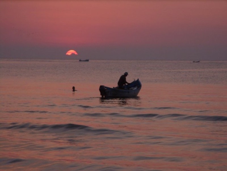 At Sunset - photogrpahy, boat, black sea, nature, birds, sunset, bulgaria, red, fisherman, water, beauty, photo, sun, sky, nice, sea, waves, man