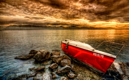 Let It Rain - beauty, sky, peaceful, water, mountains, sunset, rocks, storm, amazing, view, reflection, clouds, rainy, stormy, boat, drops, boats, landscape, sunlight, rain, lovely, red boat, nature, red, beautiful, splendor, stones, colors, sunrise, sea