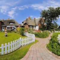 House and white picket fence.