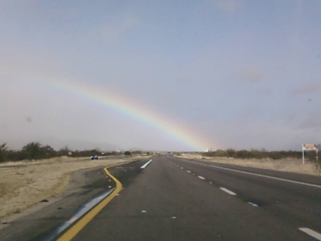 Rainbow on The Horizon - road, hwy, rainbows, desert