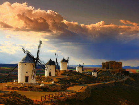 Windmills - windmills, mountains, road, landscape, rocky, hills, buildings, peaceful, sky, clouds, lovely, windows, doors