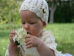 baby with flowers for Plume