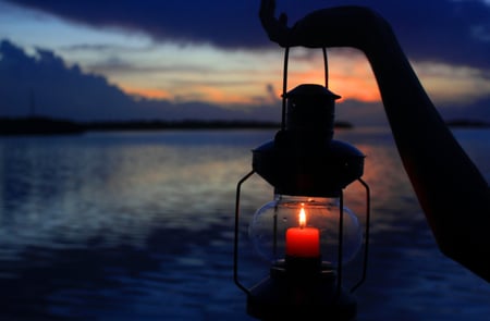 The Light - pretty, magic, blue, splendor, sunrise, lamp, light, reflection, view, sky, clouds, water, beautiful, candle, sea, drops, beauty, colors, lovely, ocean, lantern, hands, nature, hand, sunset, peaceful