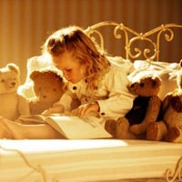 Girl with her teddy bears