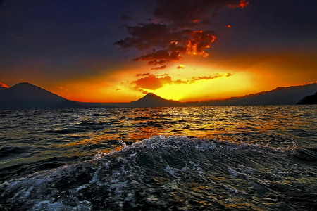 a golden sky - sky, mountains, ocean, sunset