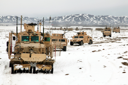 Military convoy on the move - winter, gun, military convoy, military, snow, humvee, mountain, convoy, truck, missile