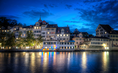 Zurich At Night - blue, splendor, night, light, reflection, view, houses, sky, clouds, house, trees, water, beautiful, windows, city, beauty, colors, lovely, architecture, buildings, tree, river, nature, lights, zurich, peaceful, building