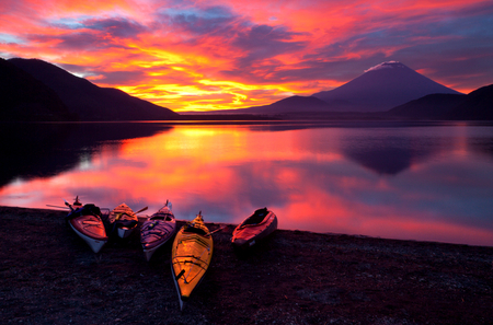 Sunset - beauty, sky, peaceful, water, colorful, sunset, mountains, view, reflection, clouds, boat, lake, landscape, boats, lovely, nature, beautiful, splendor, colors