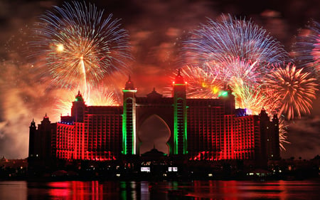 Fireworks In Dubai - magic, amazing, splendor, reflection, view, red, hotel, fireworks, hotel atlantis, sky, clouds, happy new year, beautiful, sea, city, beauty, colors, lovely, architecture, ocean, colorful, dubai, nature, new year, peaceful